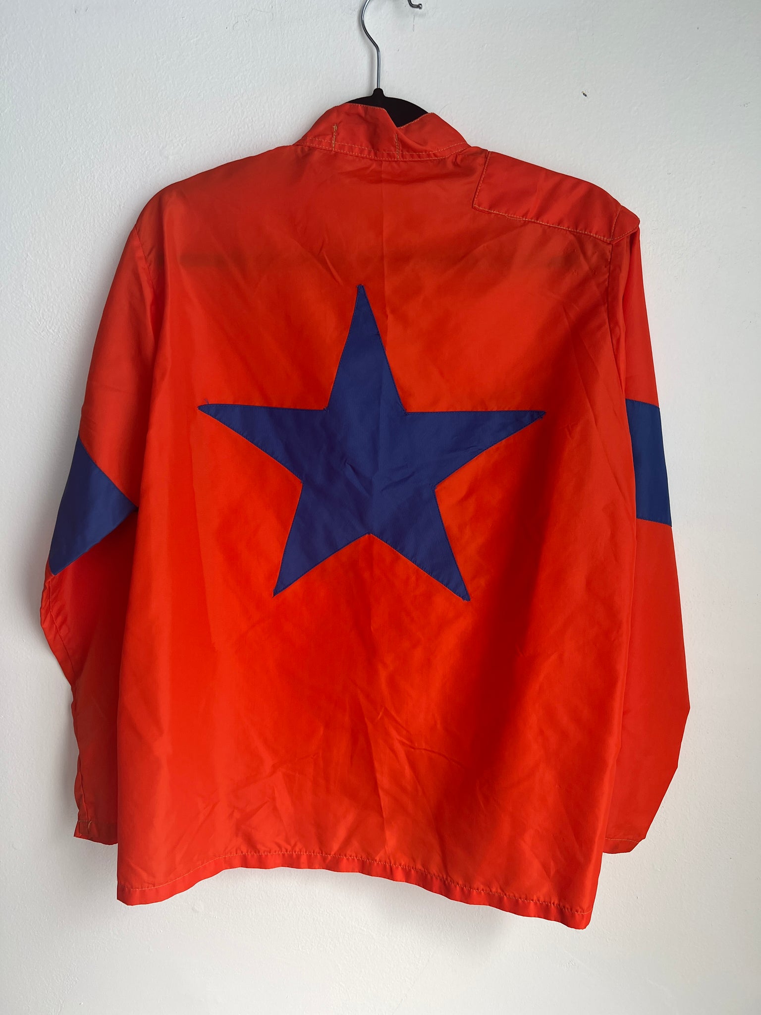 1960s MENS JACKET- orange windbreaker w/ blue star accent